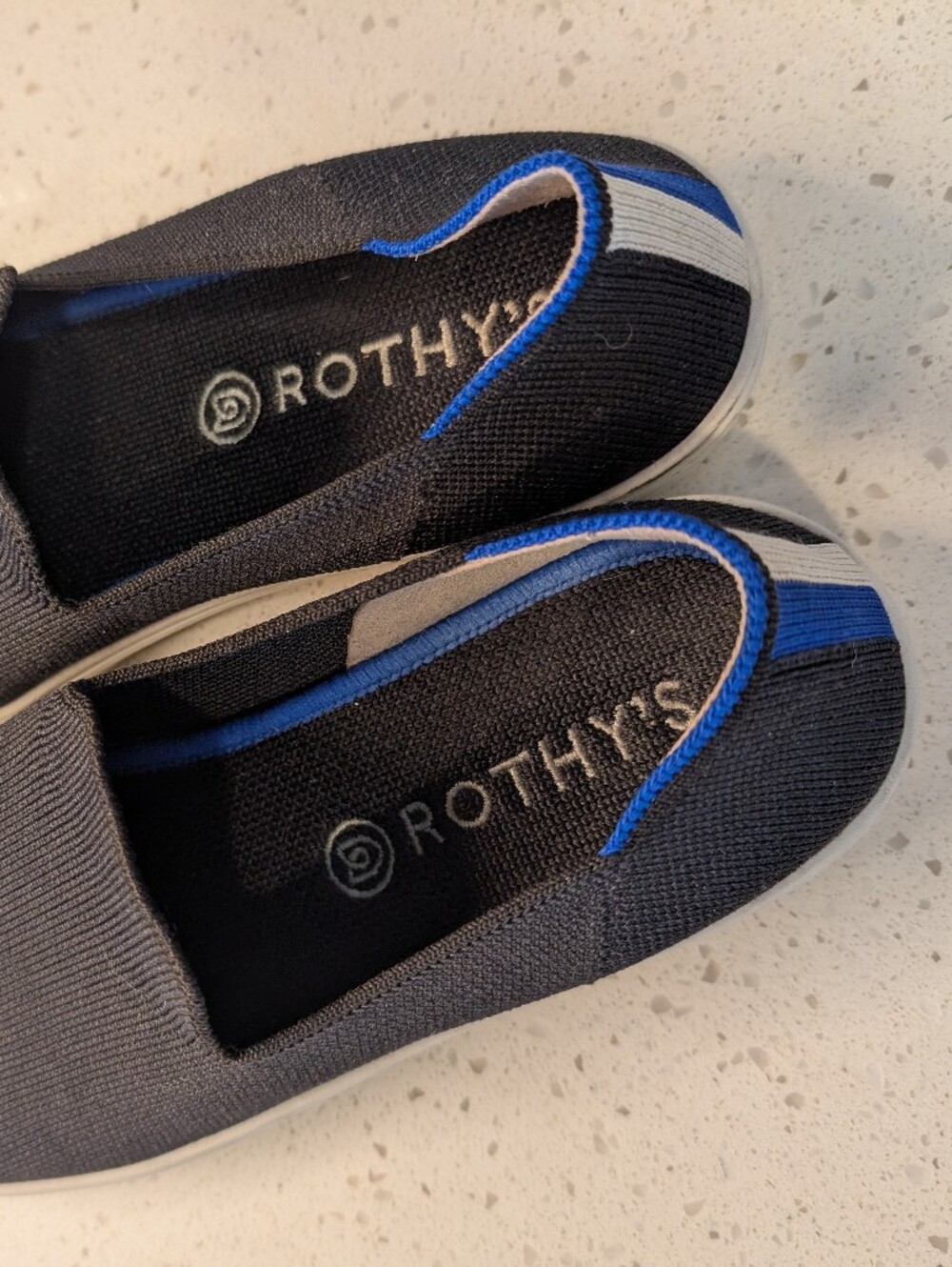 Rothy's Women's Slip-On Knit Loafers in Black with Blue Trim